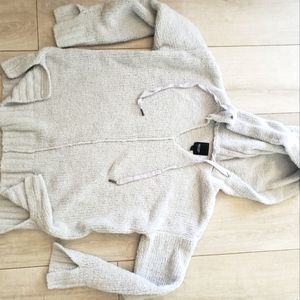 Lite blue sweater  vera wang has a couple loose stitches , hoodie